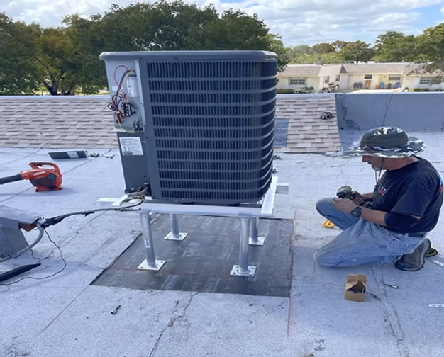 Commercial rooftop HVAC condenser installation and AC service technician in Martin County.