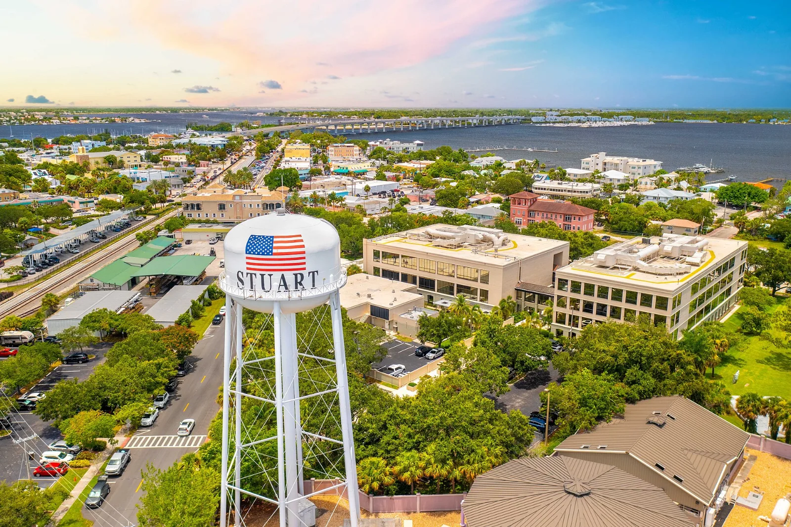 Aerial view of a water tower and downtown streets.